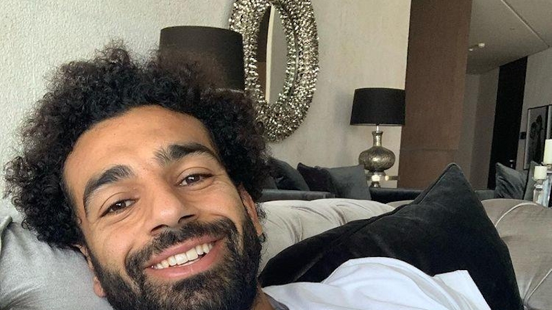 Mohamed Salah takes a selfie in his house