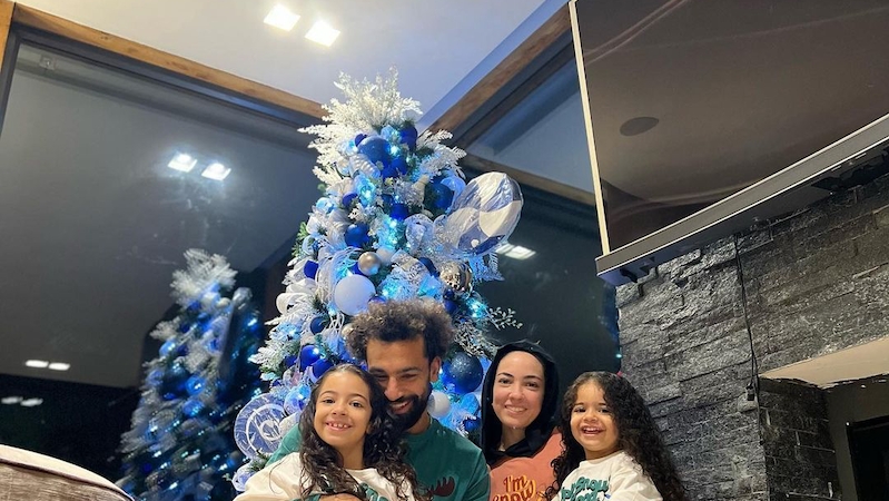 Mohamed Salah with his wife and children under a Christmas tree in his Manchester house